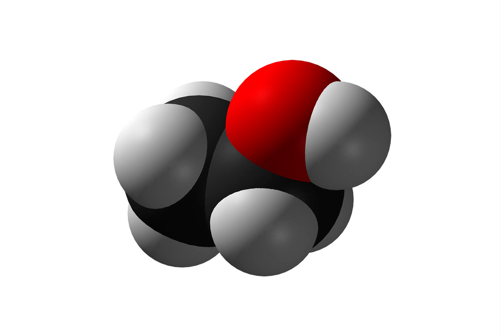 Fotografija prikazuje kalotni model molekule etanola. Model je prikazan pomoću kuglica, četiri bijele kuglice vodika, jedne sive ugljika i jedne crvene kuglice kisika.