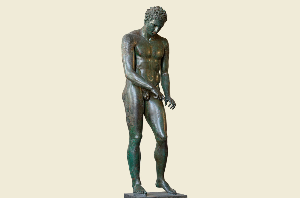 Ova slika prikazuje brončani antički kip Apoksiomena pronađen u vodama oko Lošinja.
